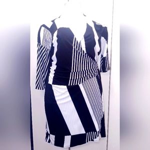 2X black and white, figure flattering, wrap dress by Emma & Michele.